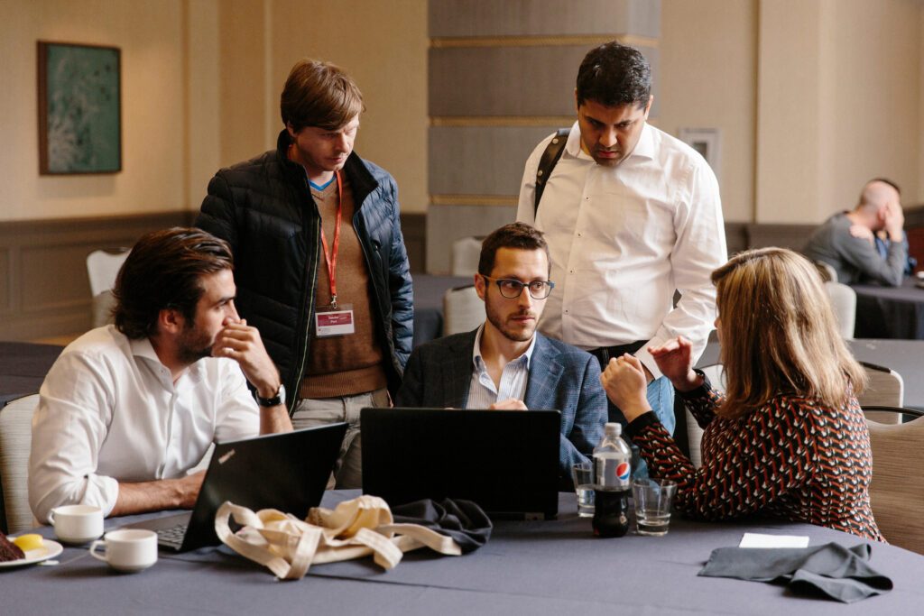 Cambridge Executive MBA (EMBA) participants working on a group assignment